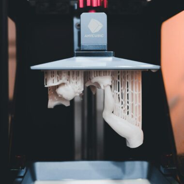 High-quality close-up of a 3D printer printing an object with resin.